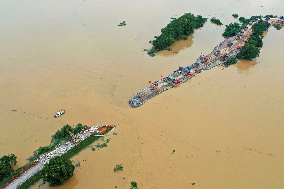 Chaos: floods across central and eastern China have left more than 140 people dead or missing