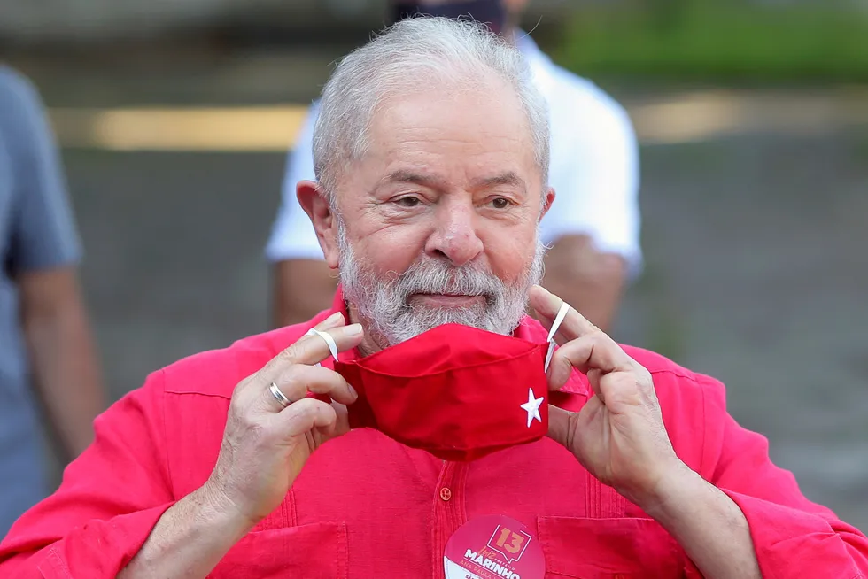 He's back: former Brazil president Luiz Inacio Lula da Silva puts on a face mask after voting at a polling station during municipal elections in Sao Bernardo do Campo in November 2020