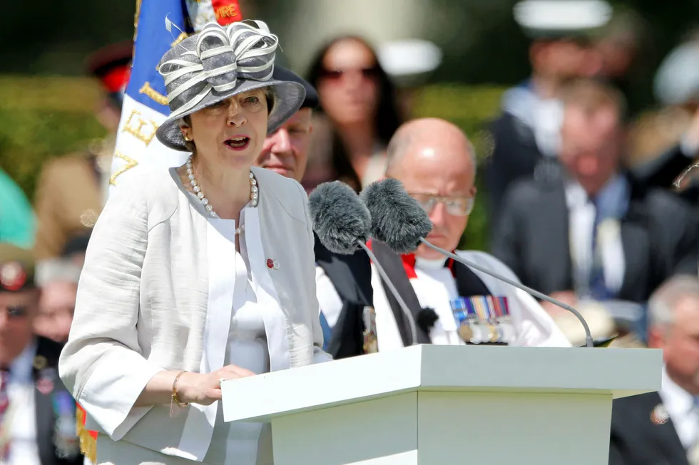 British Prime Minister Theresa May delivers a speech during the Royal British Legion’s commemoration ceremony to commemorate the 75th anniversary of D-Day, at the Commonwealth War Cemetery in Bayeux, France, June 6, 2019. REUTERS/Pascal Rossignol
