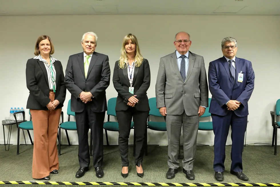 Electronically 'ousted': Petrobras chief executive Roberto Castello Branco (second from left) and chairman Eduardo Bacellar (second from right)