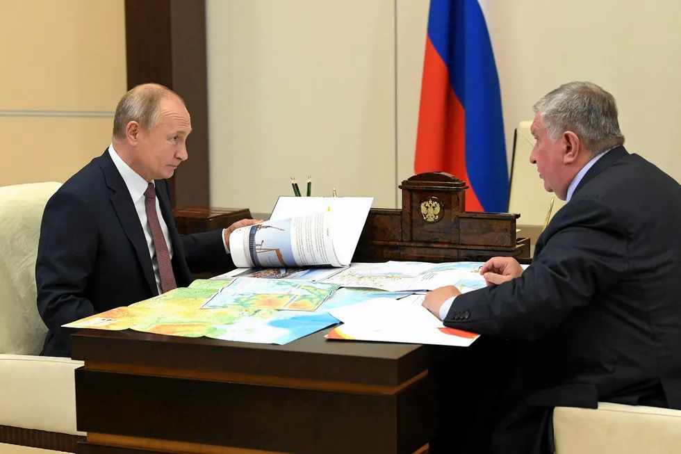 Attention: Russian President Vladimir Putin (left) listens to head of oil producer Rosneft, Igor Sechin, during their meeting to discuss Vostok Oil on 25 November, 2020