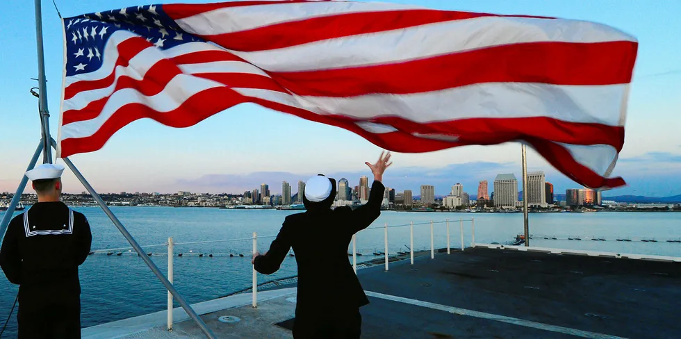 Lowering the flag aboard the aircraft carrier USS Ronald Reagan, off San Diego, California