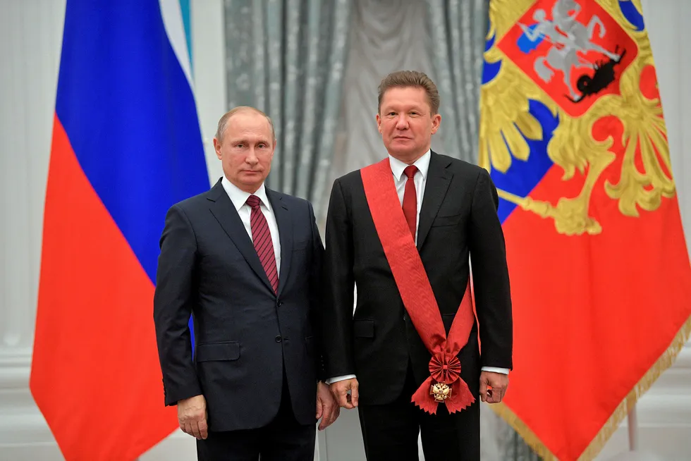 Ceremony: Russia's President Vladimir Putin (left) with Gazprom executive chairman Alexei Miller (right) after decorating him with the Order for Merit to the Fatherland, 1st Class