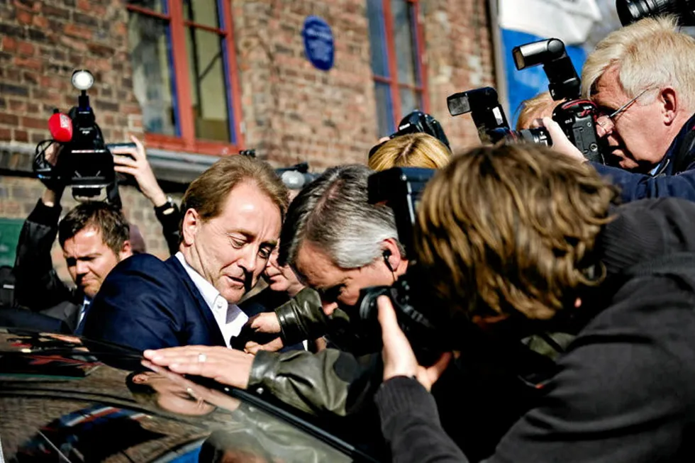 Kjell Inge Rokke is surrounded by press in his native Norway.
