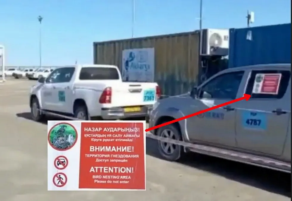 Alert: immobilised pick-up trucks with Bird Nesting Area warning notices on the Tengiz oilfield
