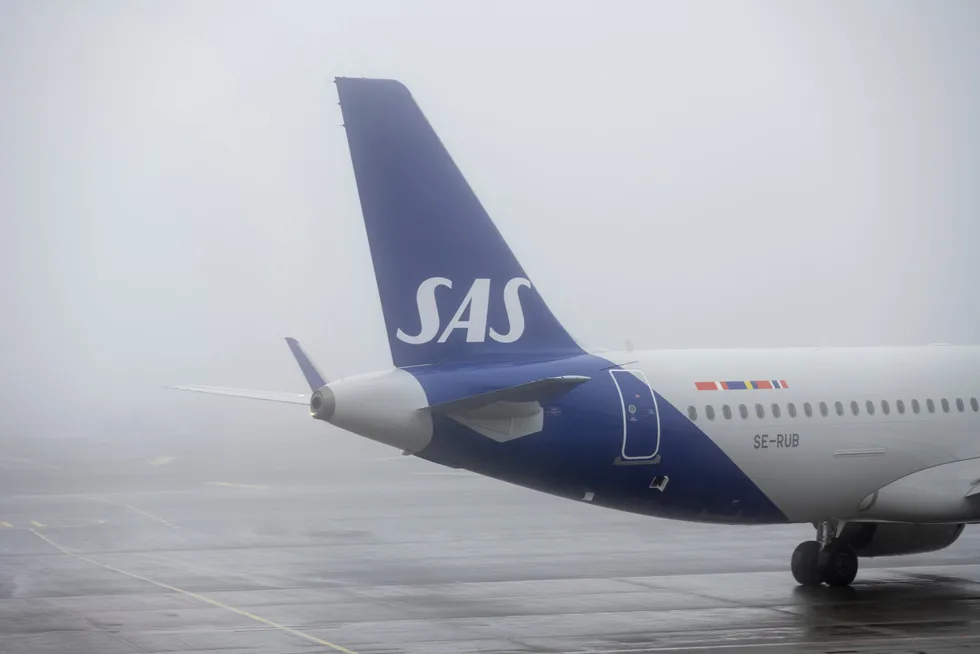 I stedet for å kvitte seg med gjeld, fikk SAS mer av dette om bord for to år siden. Her fra Oslo lufthavn.