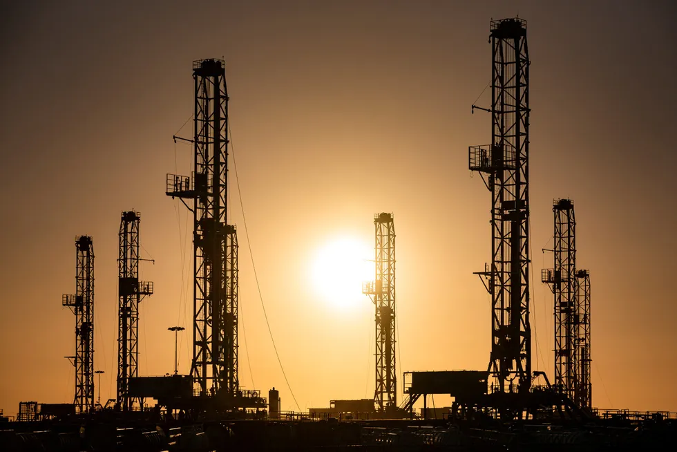 Demand growth: oil rigs sitting in storage outside of Odessa, Texas