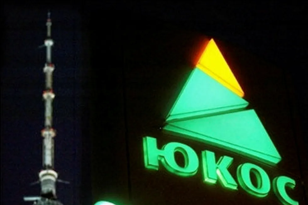 Phantom: The logo of now defunct Russian premier oil producer Yukos is seen in front of the Ostankino television tower in Moscow in 2004, the year when authorities started their attack against the company, forcing it into bankrupty