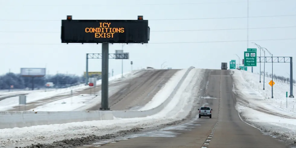 A sign warns of icy conditions on Interstate Highway 35 on February 18, 2021 in Killeen, Texas