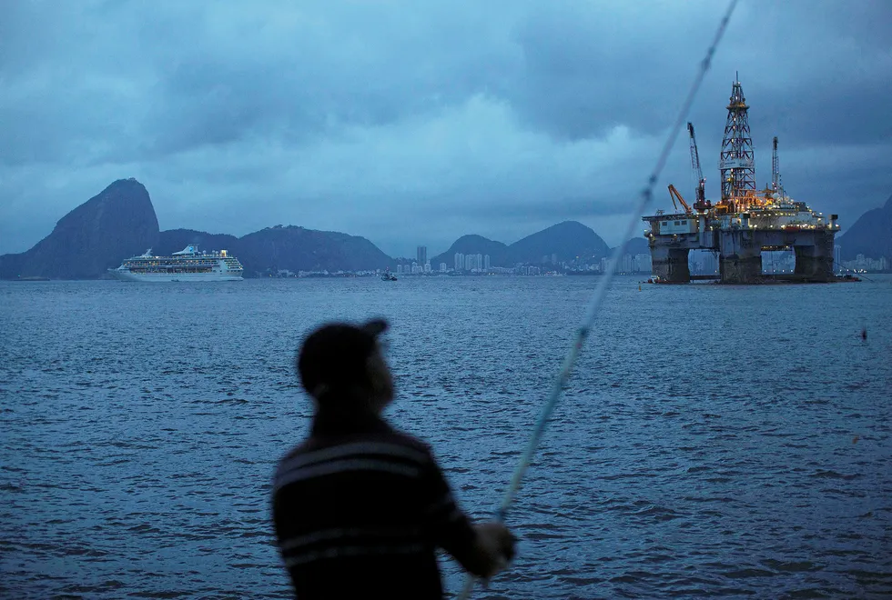 Local content: a man fishes at Guanabara bay in Niteroi, Brazil