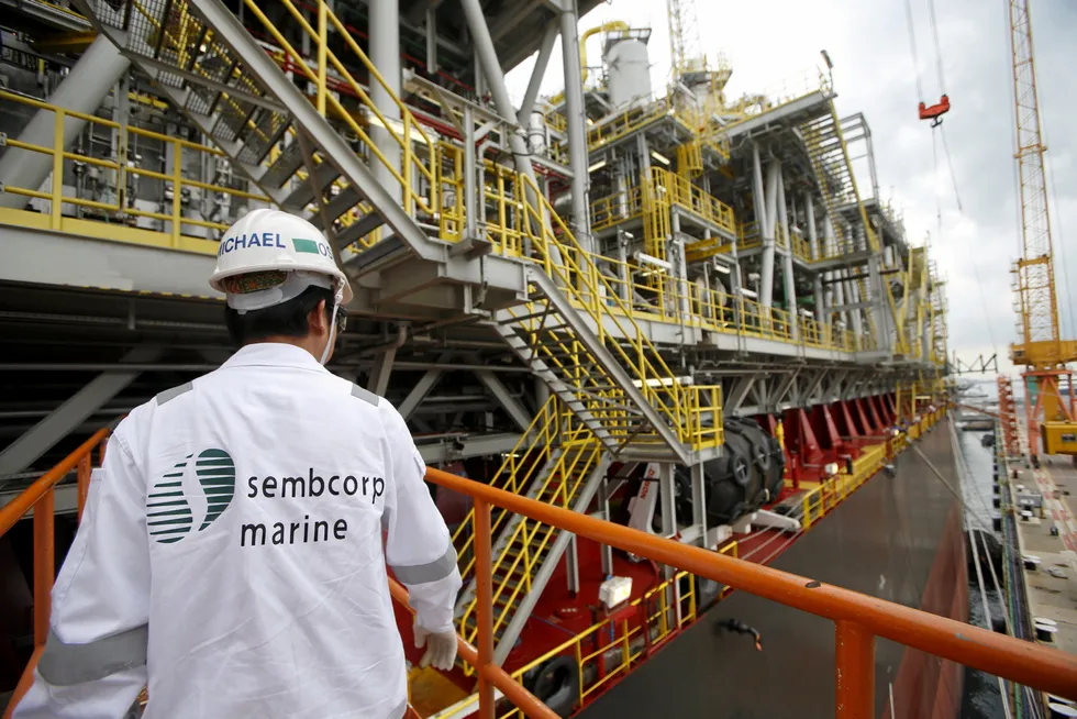 At the yard: an employee prepares to board Tullow Oil's floating production, storage and offloading vessel Prof. John Evans Atta Mills at Sembcorp Marine's Jurong Shipyard in Singapore.