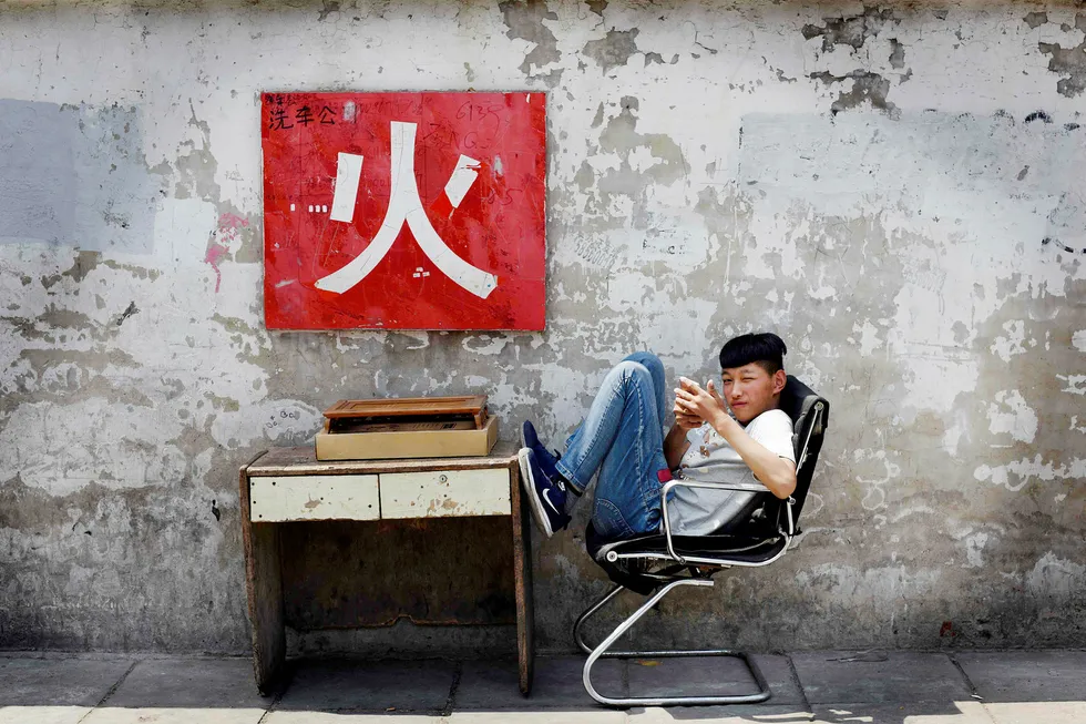 Gjelden i gråmarkedet i Kina fortsetter å vokse i urovekkende tempo til tross for dempende tiltak fra myndighetene Foto: Greg Baker/AFP/NTB Scanpix