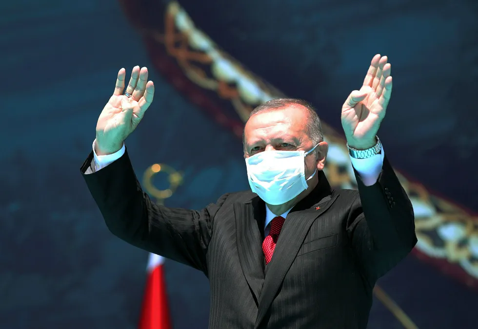 Firey speech: Turkey's President Recep Erdogan waves as he attends celebrations marking the anniversary of the 1071 battle of Manzikert