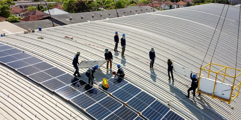 Rooftop solar is installed on a factory.