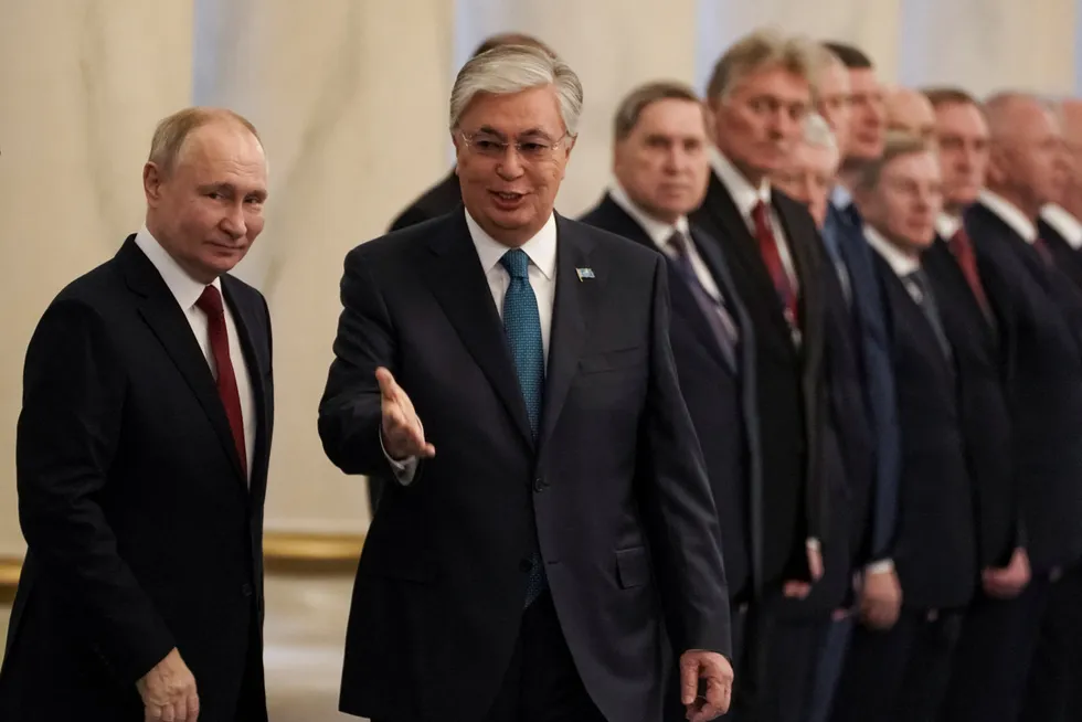 Welcome home: Russian President Vladimir Putin (left) and his Kazakh counterpart Kassym-Jomart Tokayev (centre).