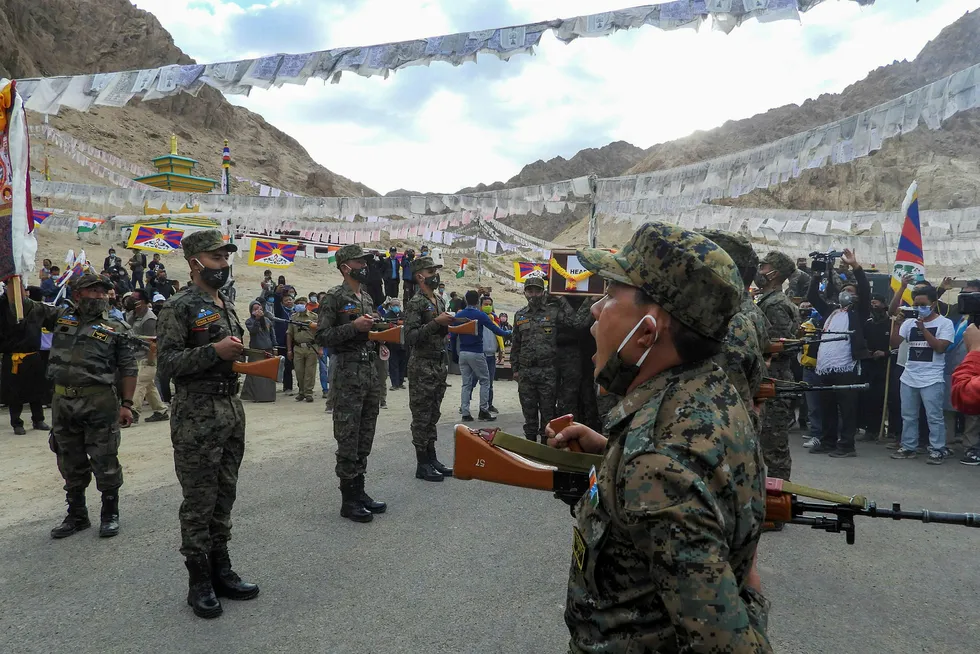 Tensions: Indian soldiers pay respects to a fallen comrade after border skirmishes with Chinese troops on the Himalayan border