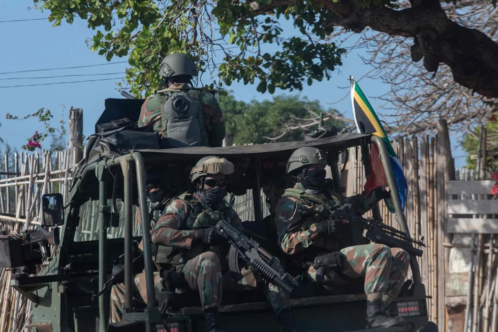 Mandate extended: a military convoy of South Africa National Defence Forces — part of an SADC Mission — rides along a dirt road in Pemba, Mozambique in August 2021
