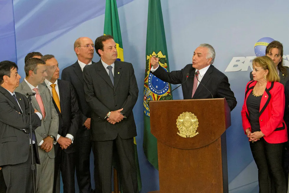 Fighting back: Brazilian President Michel Temer (right) makes a press statement after corruption charges were made against him