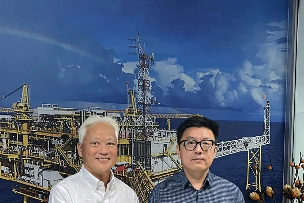 Farm-in: Energy Drilling chief executive Marcus Chew (left) with Pioneer Logistics chairman Andrew Xue after signing the Shares Subscription Agreement.