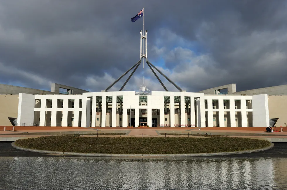 Federal government: the Australian national flag flies over Parliament House in Canberra