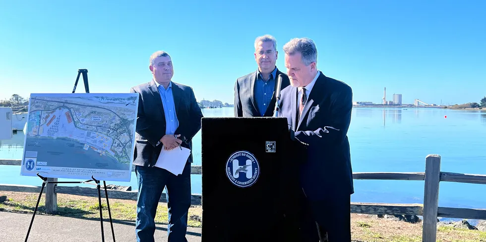 Jeff Andreini (right), Crowley’s vice president of new energy, signs a deal to launch exclusive negotiations to develop and operate a floating wind port at Humboldt Bay in Eureka, California.