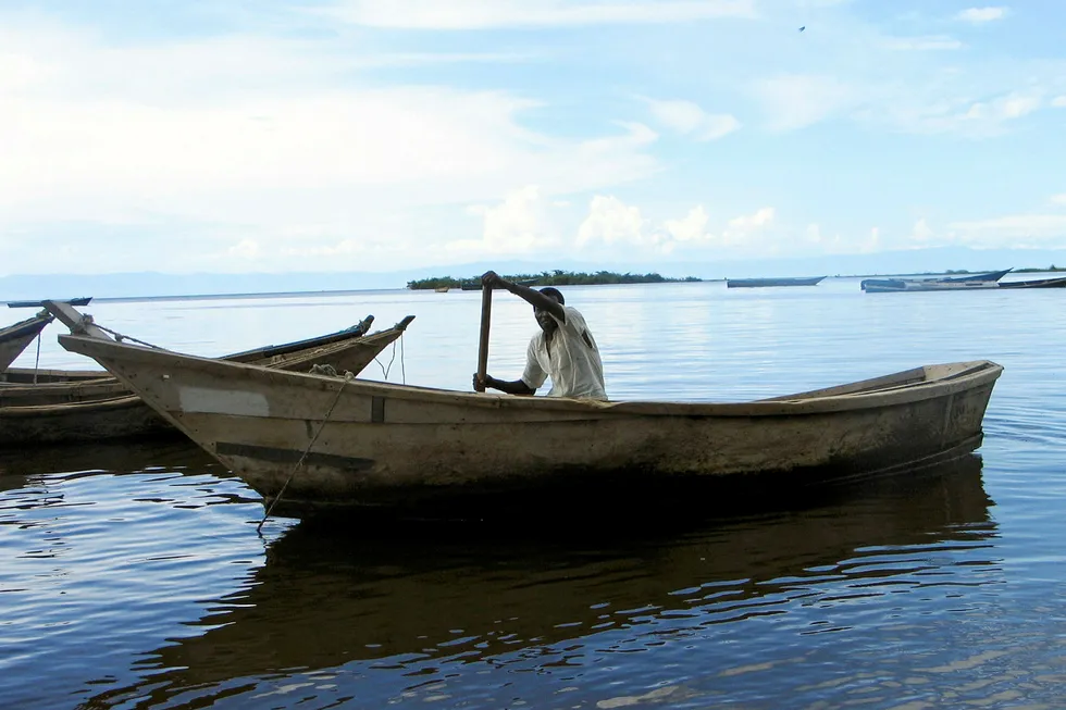 On the water: a fisherman on Uganda's Lake Albert shore