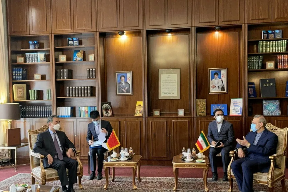 In agreement: Chinese Foreign Minister Wang Yi (left) meets with Ali Larijani (far right), advisor to Iran's Supreme Leader Ayatollah Ali Khamenei, in Tehran on 27 March