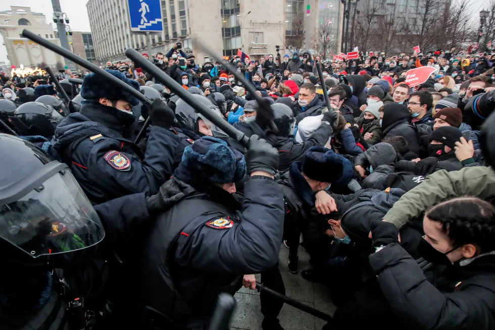 Tough response: riot police clash with protesters during a rally in support of jailed Russian opposition leader Alexei Navalny in Moscow on 23 January