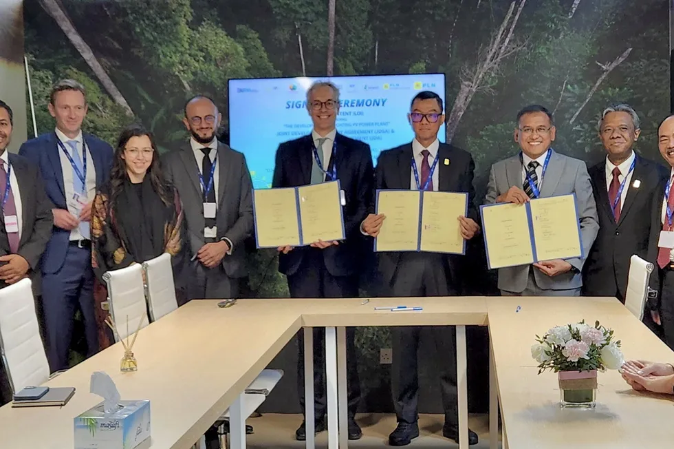 Executives from ACWA Power, PLN and Pupuk Indonesia at signing ceremony at COP28, Dubai.