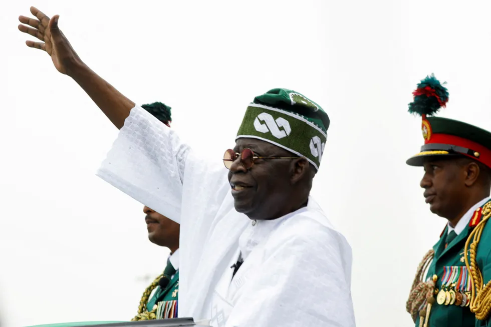 Shortfall predicted: Nigeria's President Bola Tinubu waves to a crowd in Abuja after his swearing-in ceremony in May 2023.