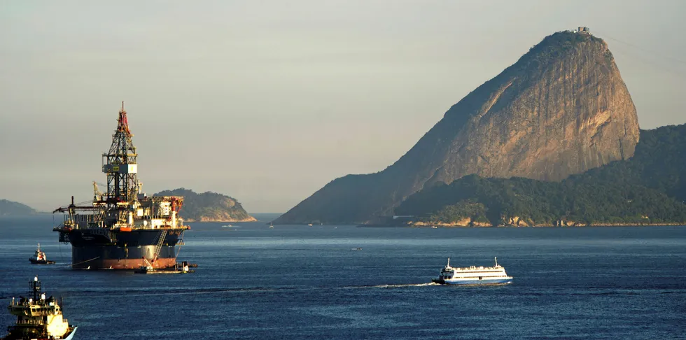 Oil production platform under tow by supply boats near in Mage, deep into the Bay of Guanabara, Rio de Janeiro, Brazil. Could it be joined by offshore wind soon?
