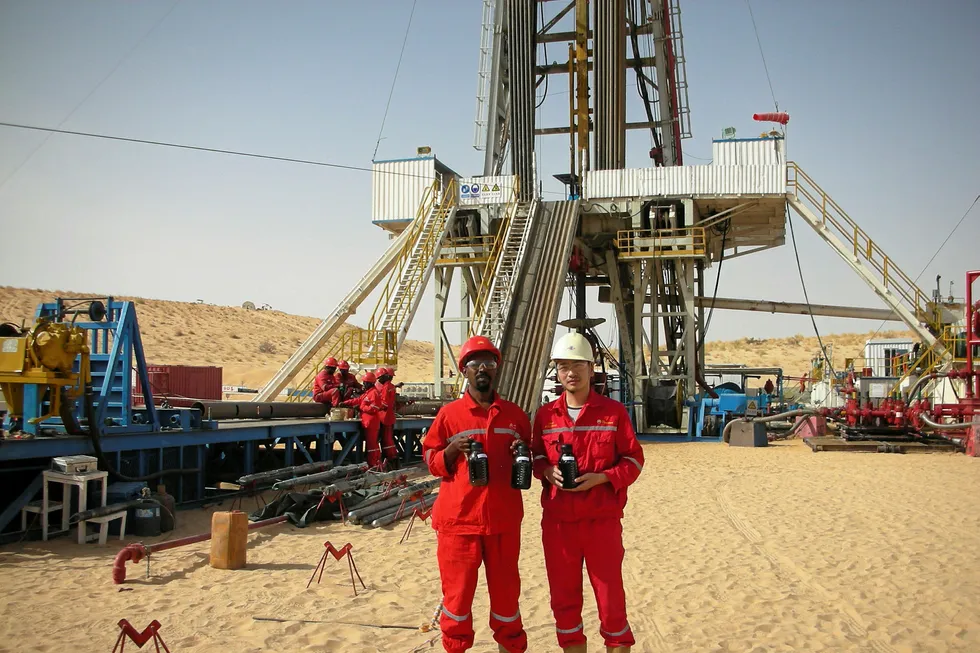 Discovery: rig crew with oil recovered from Amdigh-1