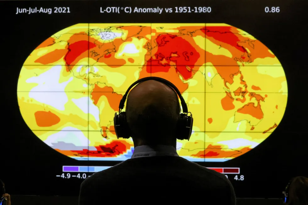 Heat map: A delegate looks at a screen during the UN Climate Change Conference (COP26) in Glasgow, Scotland