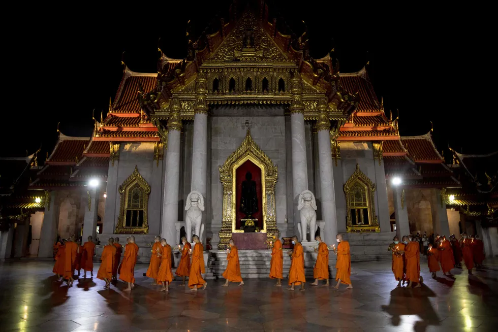 Vesak Day: Buddhist monks walk around Wat Benchamabophit Dusitwanaram in Bangkok