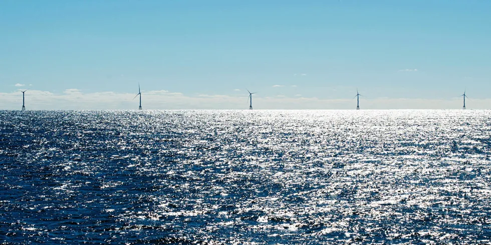 Turbines of the Block Island Wind Farm, tower above the water off the shores of Block Island, Rhode Island, as the first offshore wind project in the US.