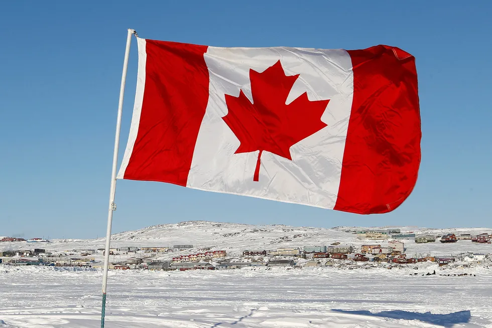 Regulatory review: a Canadian flag in Frobisher Bay in Iqaluit, Nunavut, Canada