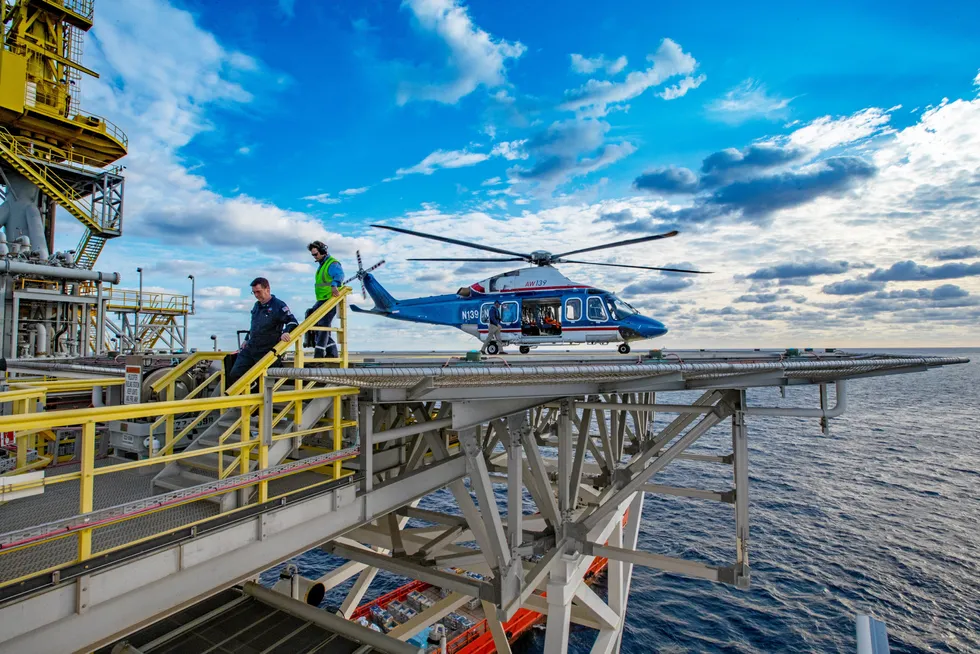 Standing by: Chevron owns and operates its own fleet of helicopters such as this AgustaWestland AW139 dropping off crew at the Jack & St Malo semi-submersible production platform in the US Gulf of Mexico
