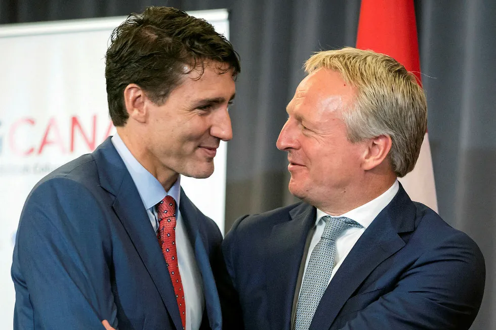 Handshake: Prime Minister Justin Trudeau (left) and Shell integrated gas and new energies director Maarten Wetselaar shake hands after the LNG Canada project sanction announcement