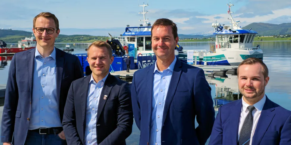 Lars Ivar Elvertrø, Jørgen Wemberg, Tommy Berg og Jan Robert Øksheim under dåpen med de nye båtene i bakgrunnen.