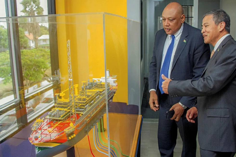 Building up: Guyana Natural Resources Minister Raphael Trotman (left) and ExxonMobil Guyana project executive CT Khoo with a model of the Liza Destiny FPSO