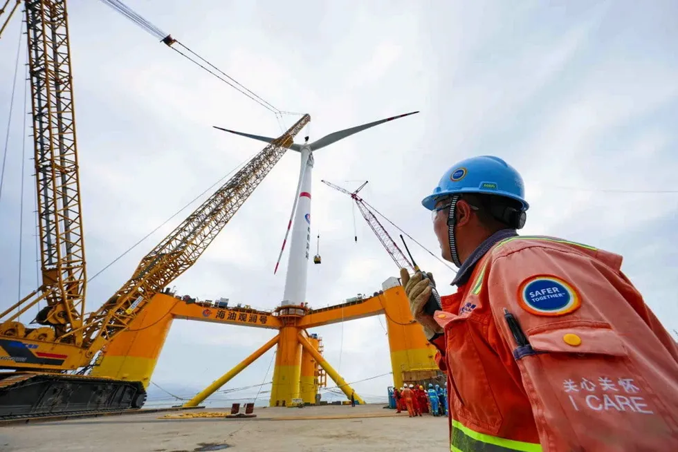 On location: CNOOC Ltd installs turbine at its pioneering deep-water wind project.