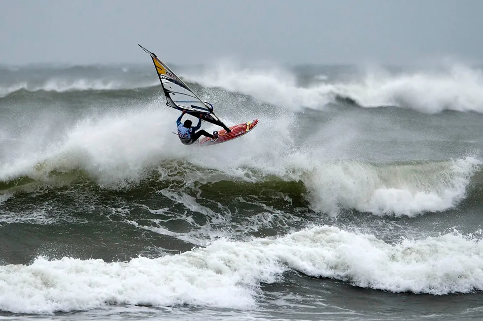 Tailwind: a windsurfer competes in the heavy wind and high waves of the North Sea near the village of Klitmoeller in northwestern Denmark