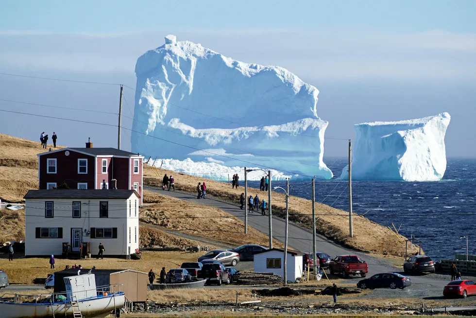 Harsh environment: residents view an iceberg as it passes South Shore, Newfoundland