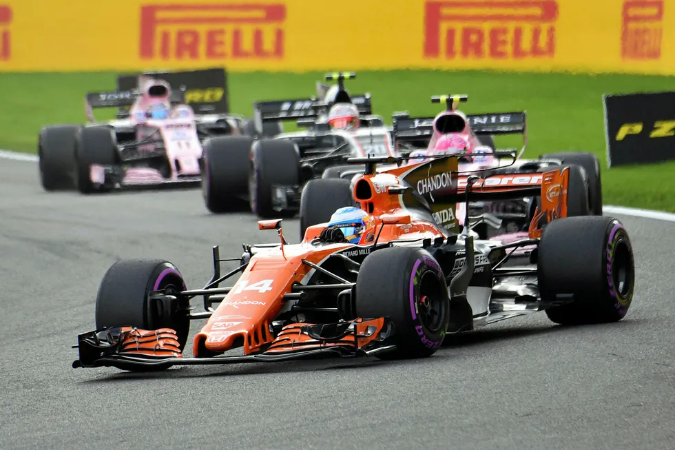 Mclaren driver Fernando Alonso of Spain, right, steers his car during the Belgian Formula One Grand Prix in Spa-Francorchamps, Belgium, Sunday, Aug. 27, 2017. (AP Photo/Geert Vanden Wijngaert)