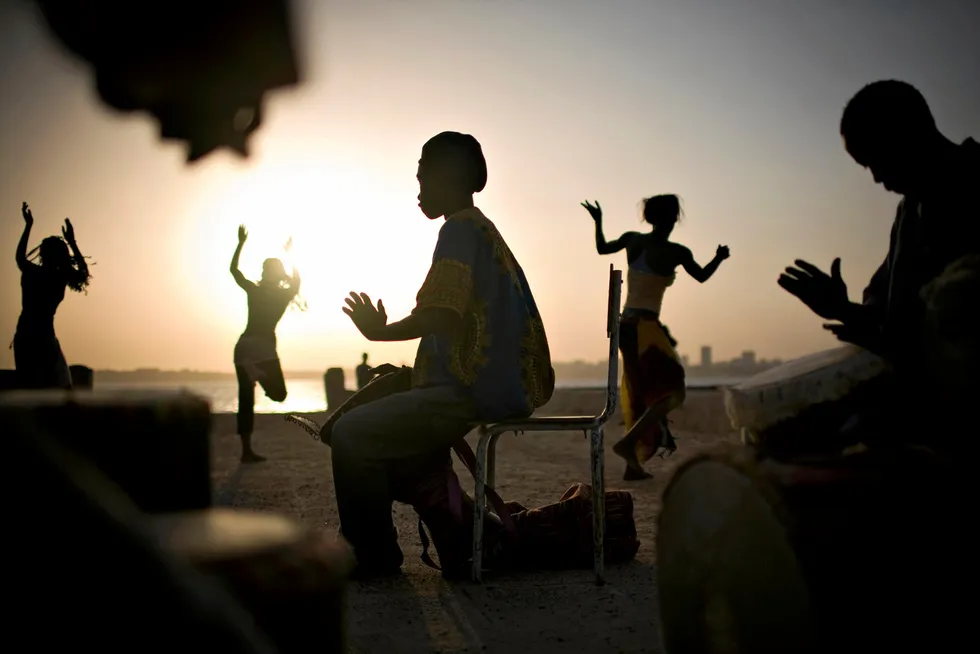 Four in contention: drummers and dancers rehearse by the ocean on Goree Island off Senegal's capital, Dakar