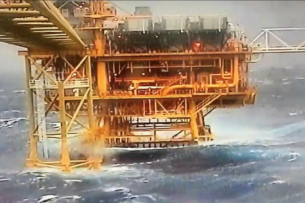 Waves crash along an oil rig as tropical storm Pabuk reaches the Gulf of Thailand in this still image taken from a video obtained from social media on 4 January