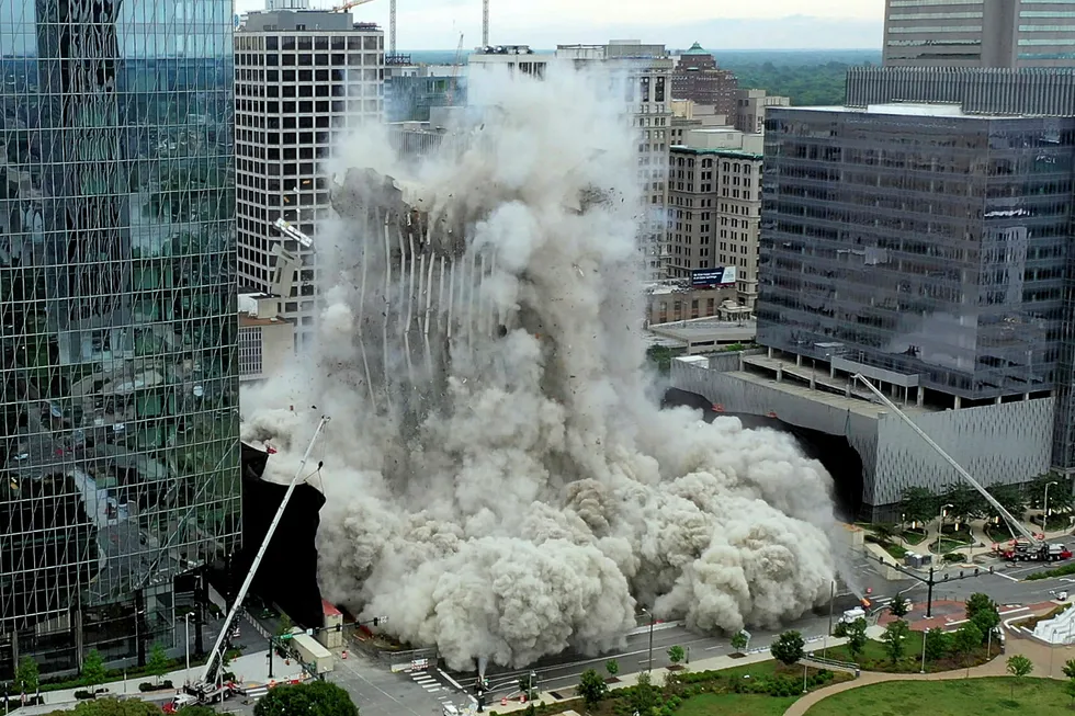 Demolition job: the 21-story Dominion Energy office building, center imploding on 30 May