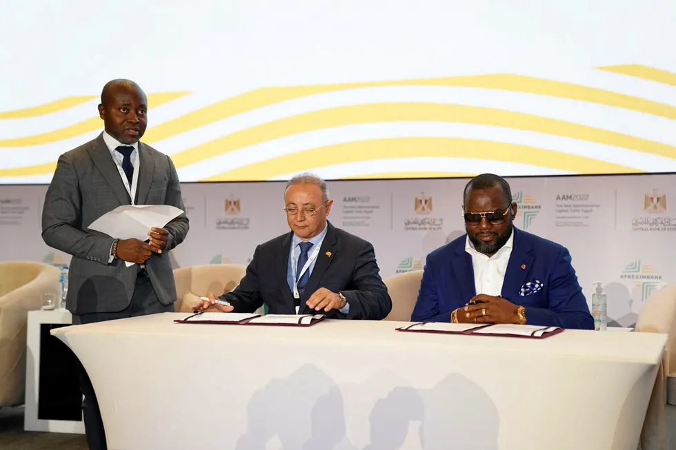 Financial help: Afreximbank executive vice president Amr Kamel (centre) and UTM chief executive Julius Rone (right) sign deal in Nigeria