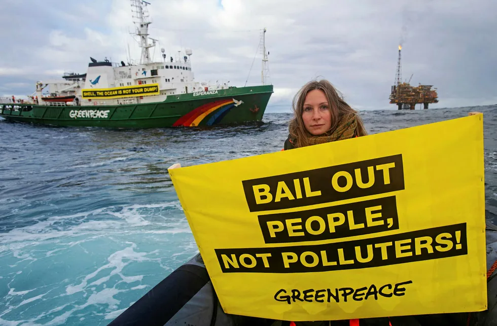 Climate action: Greenpeace activist Jennifer Ganster with Brent Charlie platform in the background