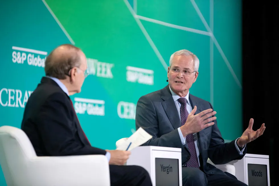 Speaking out: ExxonMobil chief executive Darren Woods (right) at the CERAWeek by S&P Global event in Houston.